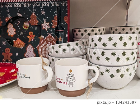 Close-Up of Christmas Tableware Set with Plates and Mugs Close-Up of Christmas Tableware Set with Plates and Mugs 134243397