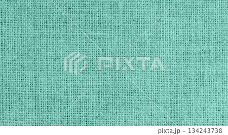 Green rough linen fabric close-up texture background 134243738