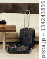 Suitcase and bag in a lobby 134243835