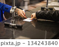 Exchanging documents through a hotel reception 134243840