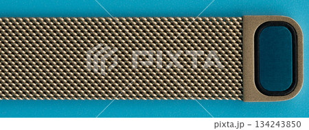 Strap for wearable device placed on a blue background Strap for wearable device placed on a blue background 134243850