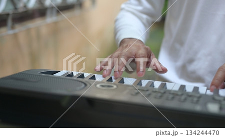 White Keyboard Keys Under Hand Composers Devotion To Music, Forming Trio Quartet On White Background 134244470