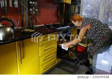 Mature woman, kitchen and cellphone for recipe, cooking and read for instructions online. Vegan, fruit and diet for health food in home, female person and internet for breakfast meal in retirement Mature woman, kitchen and cellphone for recipe, cooking and read for instructions online. Vegan, fruit and diet for health food in home, female person and internet for breakfast meal in retirement 134244598