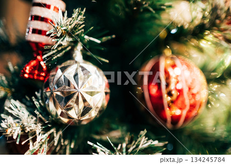 Christmas tree decorating celebrating holiday season Christmas tree decorating celebrating holiday season 134245784