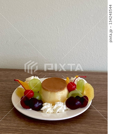 Smooth and creamy pudding with a velvety texture, offering a sweet and satisfying flavor. Perfect as a simple dessert or a refreshing treat for any occasion. 134248544