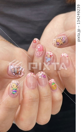 Beautiful nail art with intricate designs and vibrant colors, showcasing glossy finish, smooth texture, and detailed patterns in close-up view 134249239