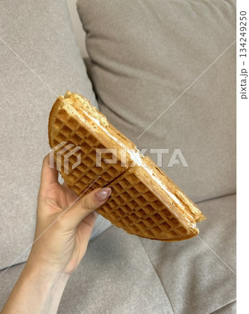 Crispy, golden waffles topped with creamy ice cream, creating a perfect balance of warm and cold, crunchy and smooth. A delightful dessert or breakfast treat, with toppings like fruits or syrup. Crispy, golden waffles topped with creamy ice cream, creating a perfect balance of warm and cold, crunchy and smooth. A delightful dessert or breakfast treat, with toppings like fruits or syrup. 134249250