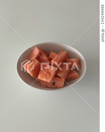 Fresh red watermelon cubes, juicy and refreshing, perfect for a sweet, hydrating snack or as a colorful addition to salads and fruit bowls. A summer favorite that offers natural sweetness. 134249488