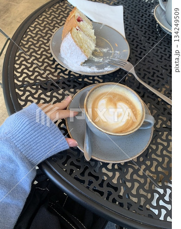 A beautifully crafted latte, featuring creamy foam art on top of rich espresso. Perfect for coffee-related projects, this image captures the warmth and inviting nature of a classic café experience. 134249509