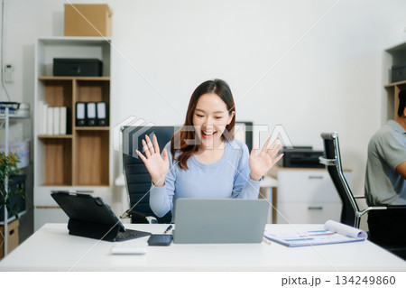 Asian business woman typing laptop and tablet Placed at the table at the office 134249860