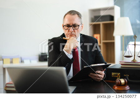 Male judge in courtroom, lawyer working in office. Perfect for business, legal advice, corporate law 134250077