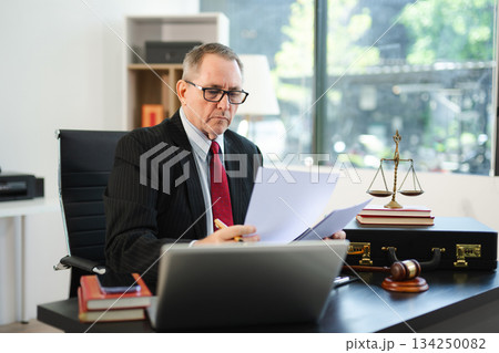 Male judge in courtroom, lawyer working in office. Perfect for business, legal advice, corporate law 134250082