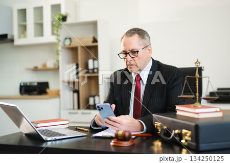 Male judge in courtroom, lawyer working in office. Perfect for business, legal advice, corporate law Male judge in courtroom, lawyer working in office. Perfect for business, legal advice, corporate law 134250125