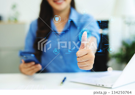 Biometric cyber security system and access control concept. Businessman using mobile smartphone tablet and laptop Biometric cyber security system and access control concept. Businessman using mobile smartphone tablet and laptop 134250764