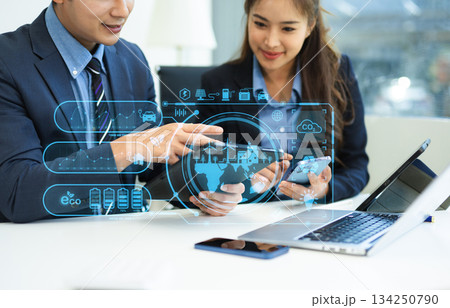 Business team working virtual modern smartphone to reduce CO2 emissions carbon footprint climate change to limit global warming.Sustainable development 134250790