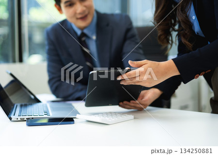 Business people making presentation with his colleagues and business smartphone, tablet digital computer 134250881