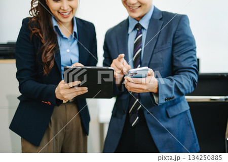 Business team meeting. professional investor working new start up project. Finance task. with smart phone and laptop and digital tablet computer Business team meeting. professional investor working new start up project. Finance task. with smart phone and laptop and digital tablet computer 134250885