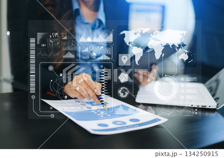 Concept of digital diagram, graph interfaces, virtual icon. Team of business analysts discussing the business strategy in contemporary 134250915