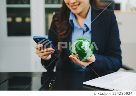 Business working with reduce CO2 concept with icons, global warming such as reforest green factory recycle and zero carbon dioxide emission concept. Business working with reduce CO2 concept with icons, global warming such as reforest green factory recycle and zero carbon dioxide emission concept. 134250924