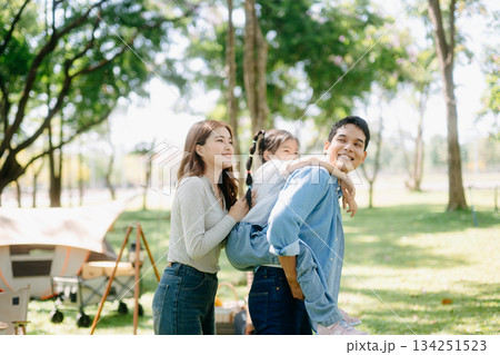 Happy parents and daughter Bakery and Bread Fruit enjoy in a sunny garden. A joyful summer picnic full of love, food for family, outdoor Happy parents and daughter Bakery and Bread Fruit enjoy in a sunny garden. A joyful summer picnic full of love, food for family, outdoor 134251523