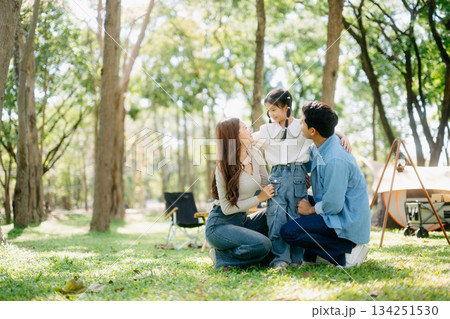 Happy parents and daughter Bakery and Bread Fruit enjoy in a sunny garden. A joyful summer picnic full of love, food for family, outdoor Happy parents and daughter Bakery and Bread Fruit enjoy in a sunny garden. A joyful summer picnic full of love, food for family, outdoor 134251530