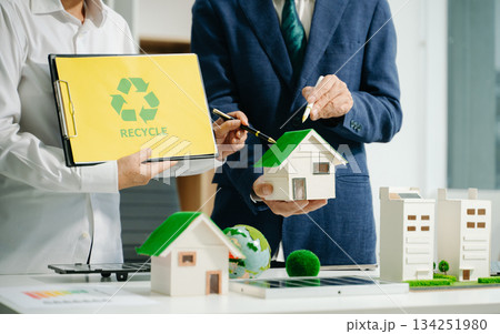 business team people planning and discussing on recycle reduce reuse policy symbol in office meeting room. business team people planning and discussing on recycle reduce reuse policy symbol in office meeting room. 134251980