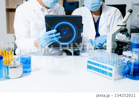 Medical technology, doctor use AI robots for diagnosis and increasing accuracy patient treatment in future. doctor hand working with tablet, computer with his team Medical research to improve patient 134252011