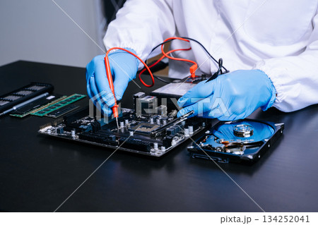 Electronics technician, electronic engineering electronic repair, electronics measuring and testing, repair and maintenance concepts.uses a voltage meter to check 134252041