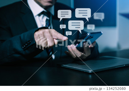 Man hands  User typing on smartphone and tablet chatting conversation in chat box icon pop up for social media marketing technology concept. 134252080