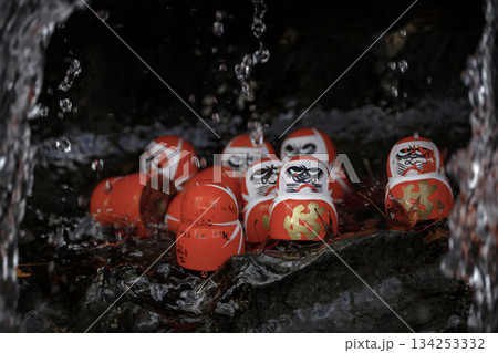 Small red Daruma dolls in Katsuoji Temple. A Traditional red Daruma doll is used as a symbol of determination in Japanese culture at Katsuo-ji temple, Osaka, Japan Small red Daruma dolls in Katsuoji Temple. A Traditional red Daruma doll is used as a symbol of determination in Japanese culture at Katsuo-ji temple, Osaka, Japan 134253332