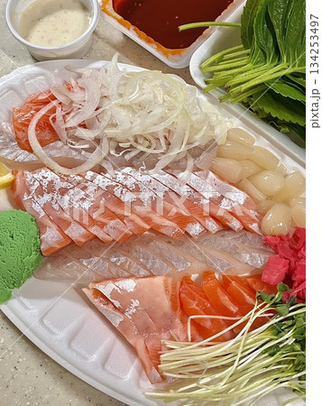 Fresh and delicate sashimi slices, beautifully presented with vibrant colors and perfect cuts. This traditional Japanese delicacy highlights the pure flavors of premium seafood. Fresh and delicate sashimi slices, beautifully presented with vibrant colors and perfect cuts. This traditional Japanese delicacy highlights the pure flavors of premium seafood. 134253497