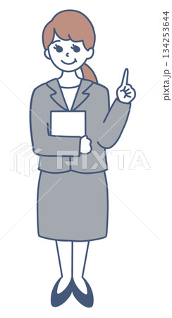 指差しで説明をするスーツの女性の全身イラスト素材 134253644