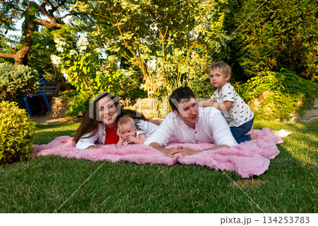 Stacked snuggles on a pink blanket 134253783