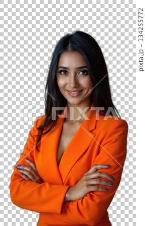 A South Asian female leader in bright orange, arms confidently crossed, surrounded by light projections of success and financial growth 134255772