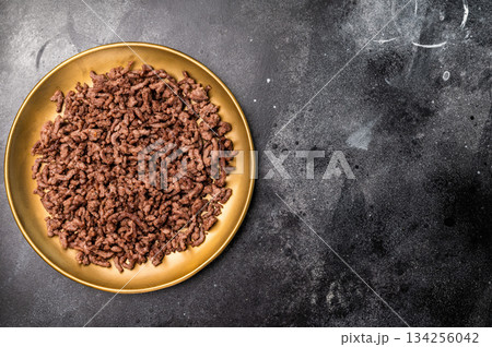 Roast and Fried mince meat, fresh cooked ground meat in a plate. black background. top view 134256042