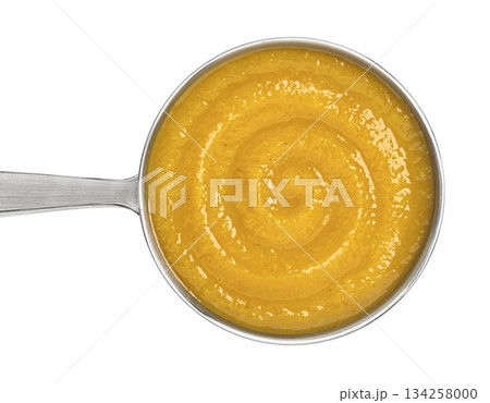 Ladle with pumpkin cream soup isolated on white background with clipping path, top view 134258000