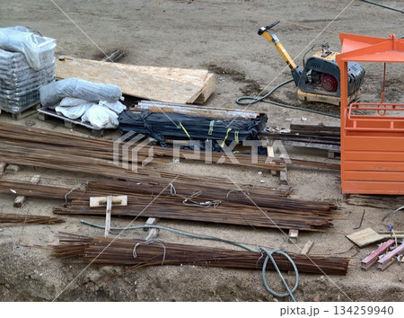 setting up work area with systematic arrangement of building supplies and machinery for track 134259940
