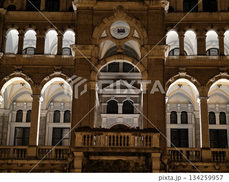 historic architecture glowing, detailed depiction of ornate arches and textured masonry illumination 134259957