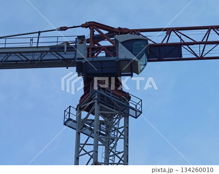 bright daytime industrial scene, sunlit tower showcases detailed steel framework and platform stairs bright daytime industrial scene, sunlit tower showcases detailed steel framework and platform stairs 134260010