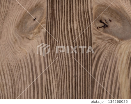 craftsman shapes rustic wooden tabletop, artisan carves warm wood with distinct knots and grains 134260026