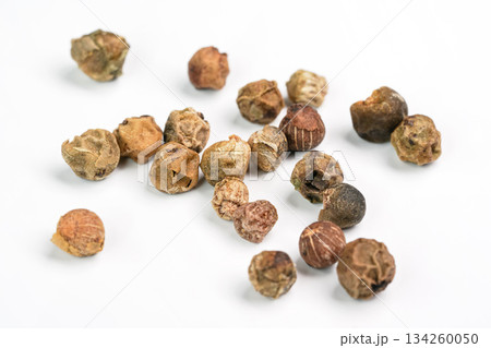 Green peppercorns isolated on white background board, closeup view from above Green peppercorns isolated on white background board, closeup view from above 134260050