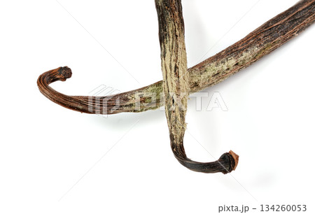 White / yellow mould or mildew growing on vanilla sticks stored improperly in wet and cold fridge - close up detail photo isolated on white background 134260053