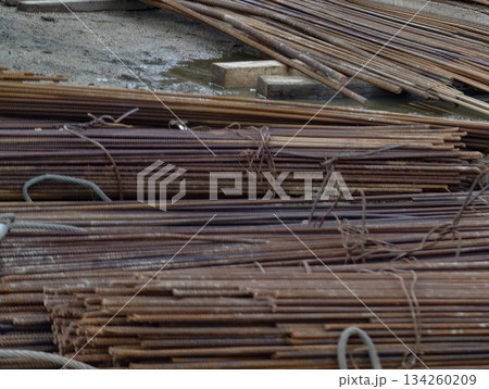 scrap rebar in yard environment, rusty metallic rebars bundled and prepared for recycling process scrap rebar in yard environment, rusty metallic rebars bundled and prepared for recycling process 134260209