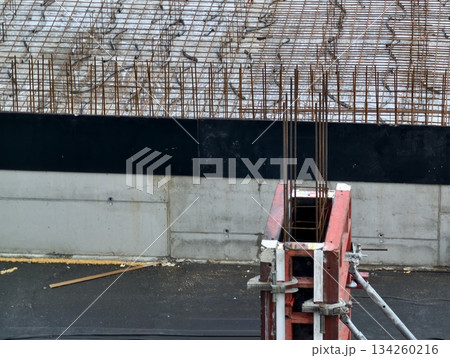 urban building support elements, industrial urban setting with construction materials and markings 134260216