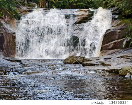 cascade into nature, layered waterfall cascading into calm forest pond surrounded by vibrant foliage cascade into nature, layered waterfall cascading into calm forest pond surrounded by vibrant foliage 134260324
