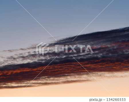 colorful sky with dramatic clouds, evening horizon showcasing striking cloud patterns in vivid shades colorful sky with dramatic clouds, evening horizon showcasing striking cloud patterns in vivid shades 134260333