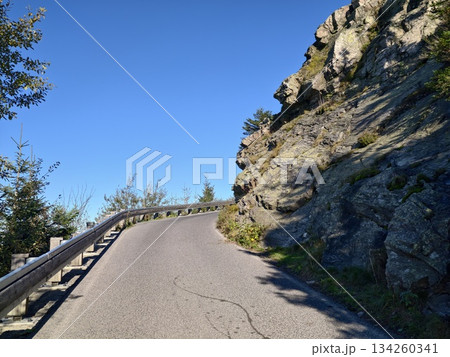 winding ascent through rocky landscape offering expansive horizon views and adventure opportunities 134260341