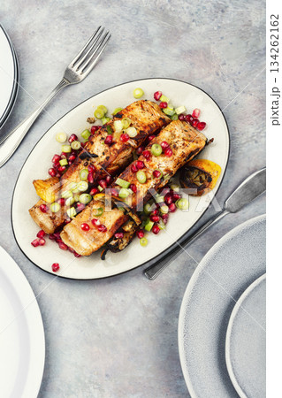 Two grilled salmon steaks on a wooden table. Two grilled salmon steaks on a wooden table. 134262162