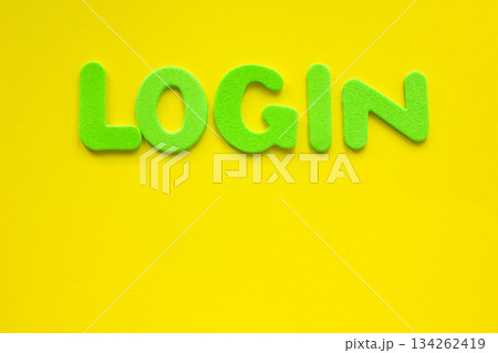 The word LOGIN made with green letters written on a yellow background. The word LOGIN made with green letters written on a yellow background. 134262419