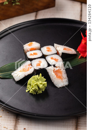 Salmon maki sushi rolls on black plate Salmon maki sushi rolls on black plate 134264110